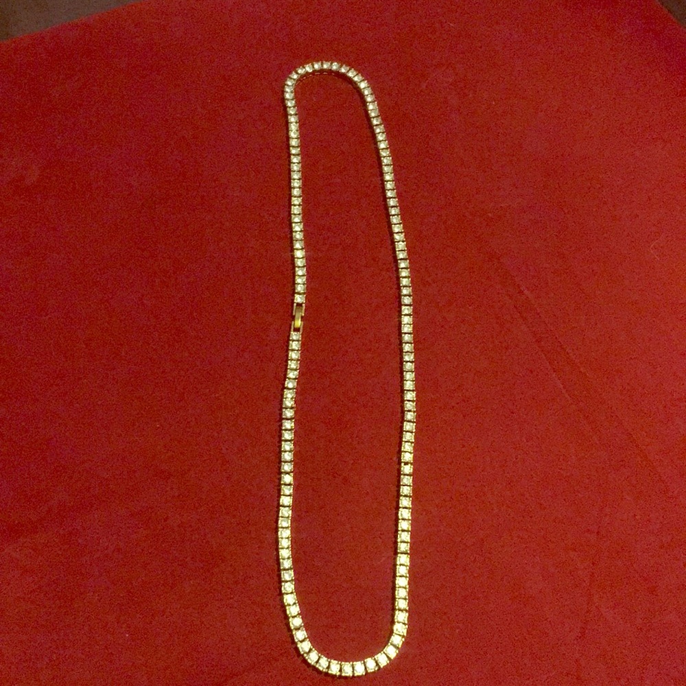 A 18k gold tennis chain with real cranium crystals